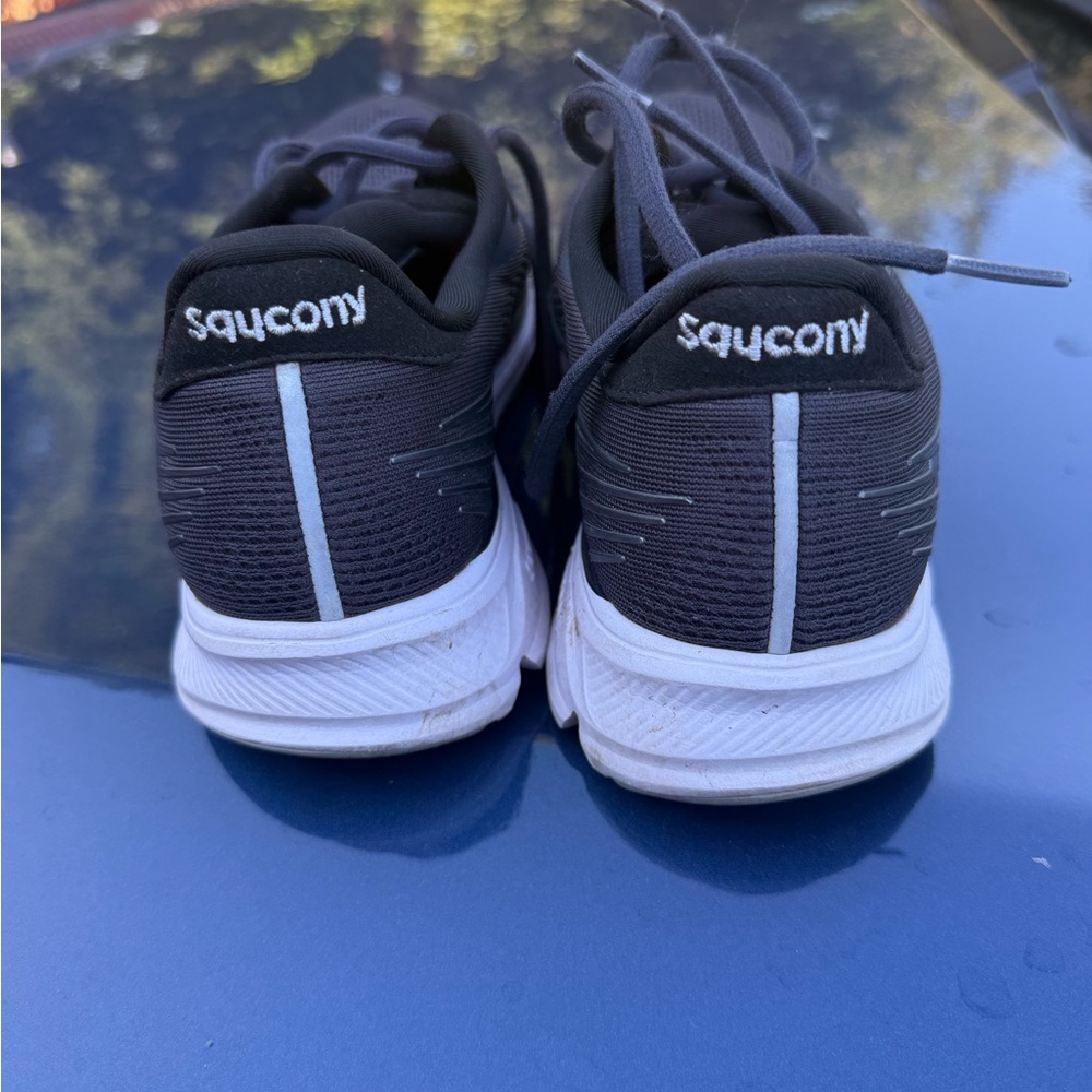 Saucony Black and White Sneakers with Distinctive Stripe